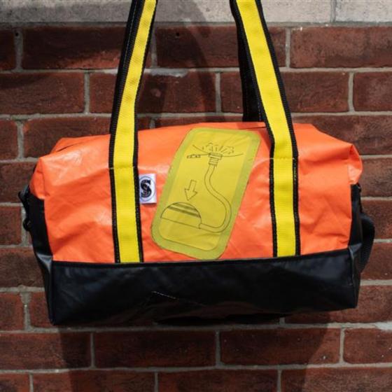Opposite view, orange with raft feature and yellow straps