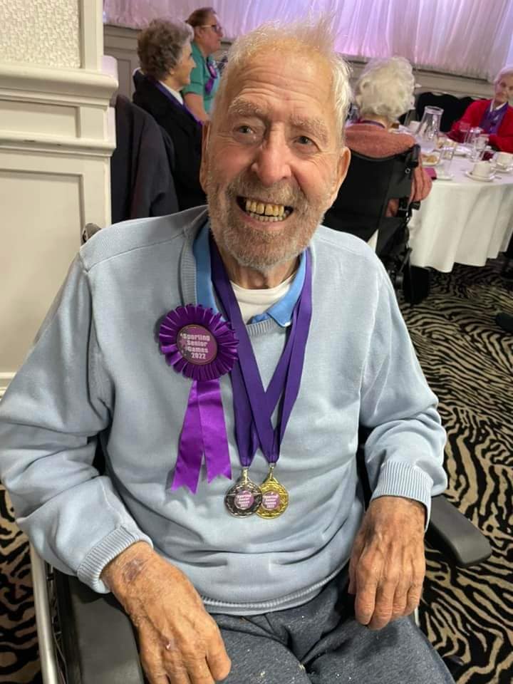 Sandy with medal signifying his participation in the Sporting senior games 2022