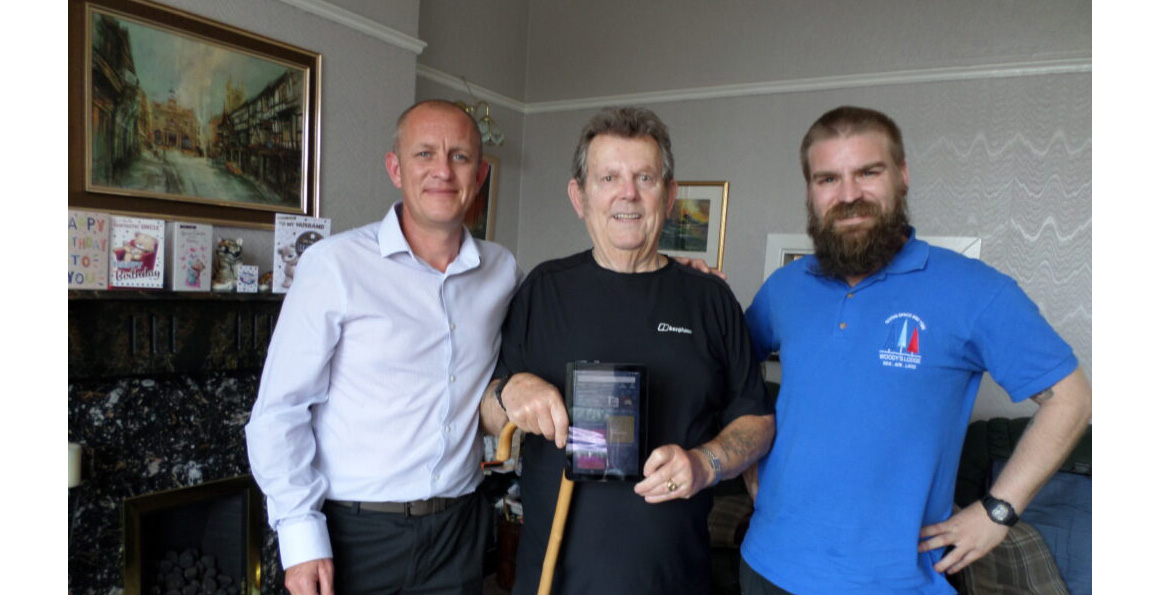 Veteran Colin Williams, receiving his device to help him stay connected.