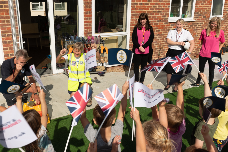 Children from Wooden Tots Nursery cheering Jane on