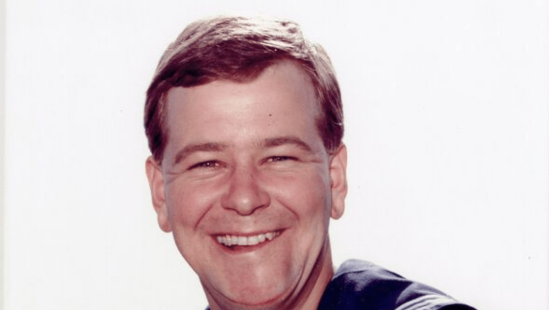 Man in a Sailors uniform looking directly at the camera
