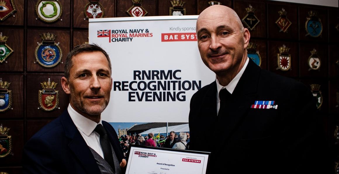 Richard Holmes, Chief Executive at Kings Camp, presenting Warrant Officer Class 1 Paul Nash RN with an award for his huge involvement with the project 