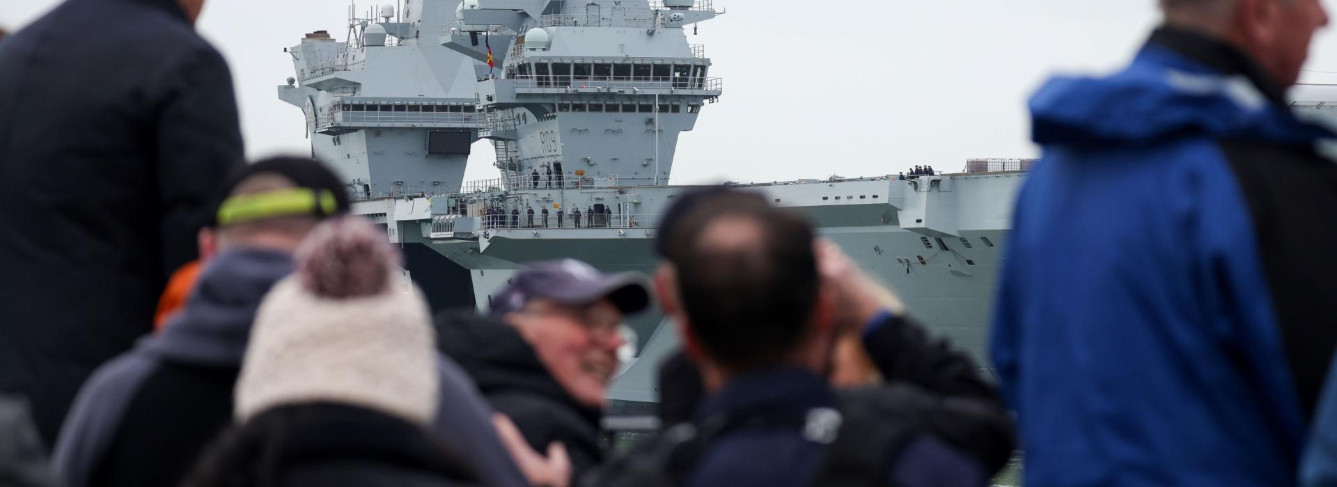 People looking at a Ship coming in 