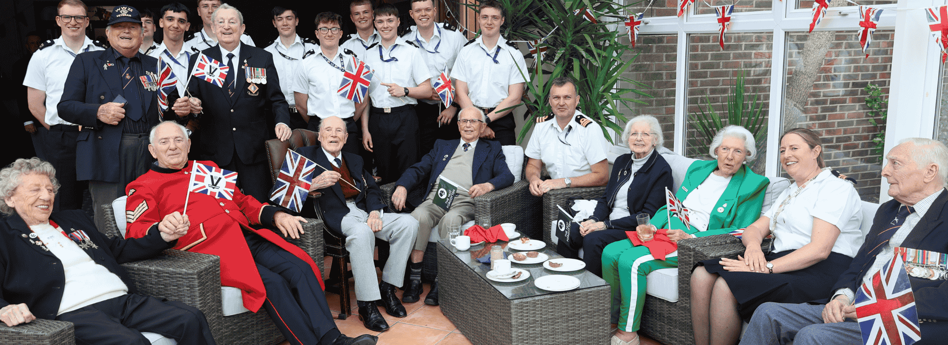Veterans sat celebrating with serving Navy.