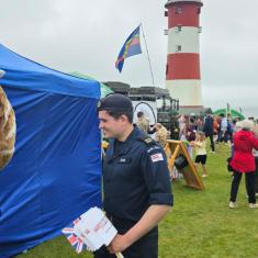 Serving personnel by the lighthouse