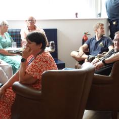 People gathered - sat down and standing in the new all ranks mess at INM