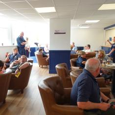 People gathered - sat down and standing in the new all ranks mess at INM