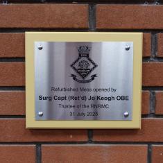 Surgeon Captain Jo Keogh OBE & RNRMC plaque on wall at INM
