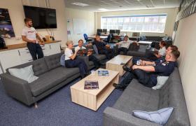 Group of  Senior Engineering trainees at HMS Sultan relaxing in a lounge area, conversing.
