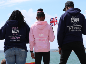 3 Members of a family wearing matching jumpers
