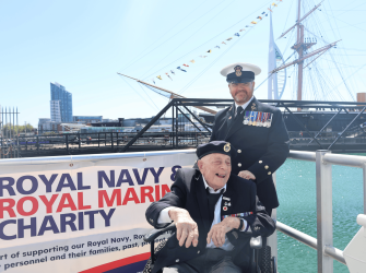 Veteran sat in a wheelchair laughing 