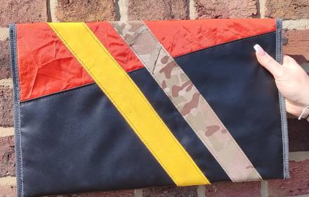Back of case. Red and Black with camo and yellow strap.