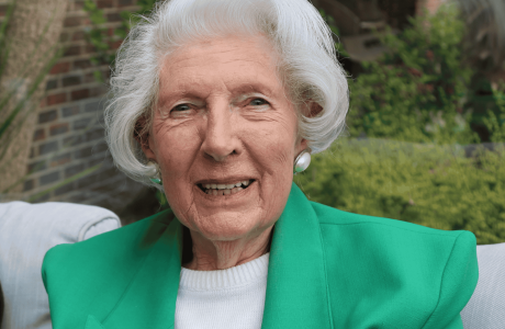 Lady looking into the camera, smiling.