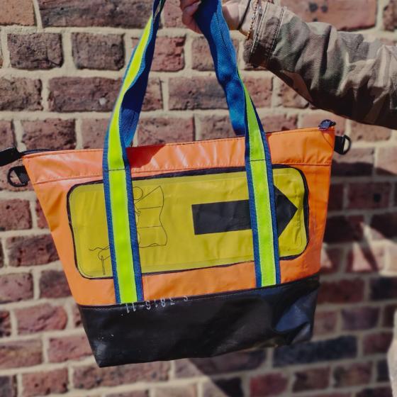 orange with yellow life raft feature, bright green and blue strap.