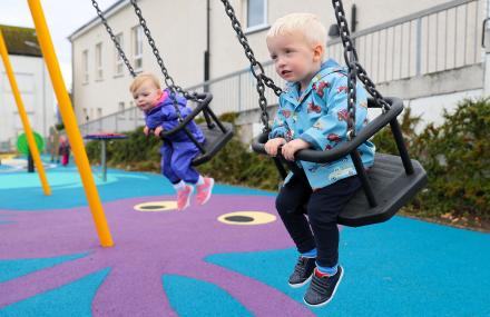 Children playing on swings at new Drumfork Children's Playpark