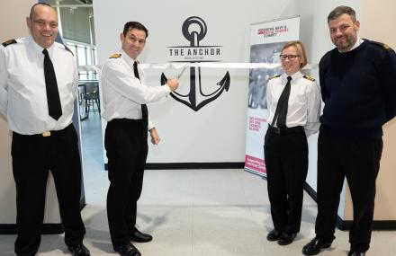 Captain Tim Davey cutting bow for official opening 