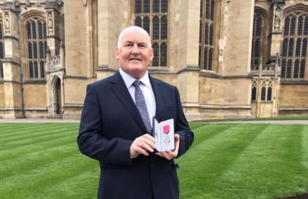 Dean holding award 