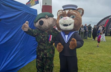 Nelson the mascot by the lighthouse in Plymouth