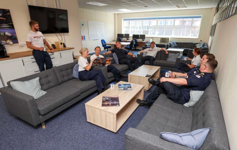 Group of  Senior Engineering trainees at HMS Sultan relaxing in a lounge area, conversing.